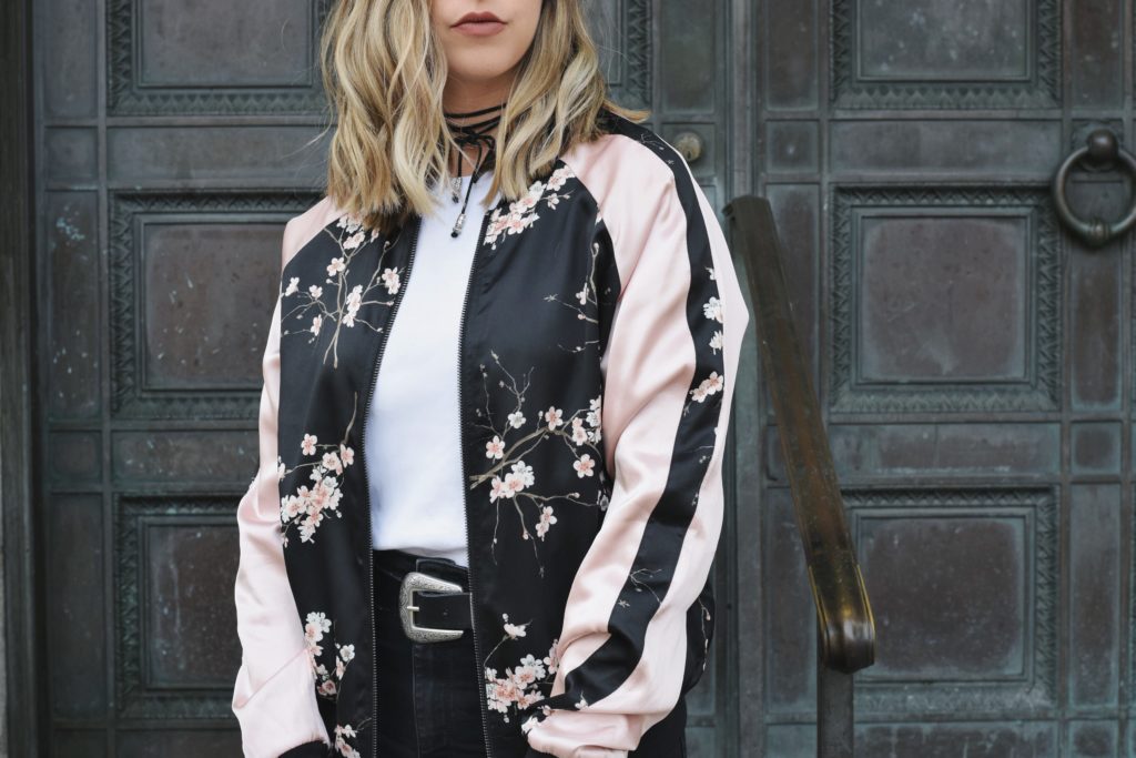 wearing a floral bomber jacket for fall