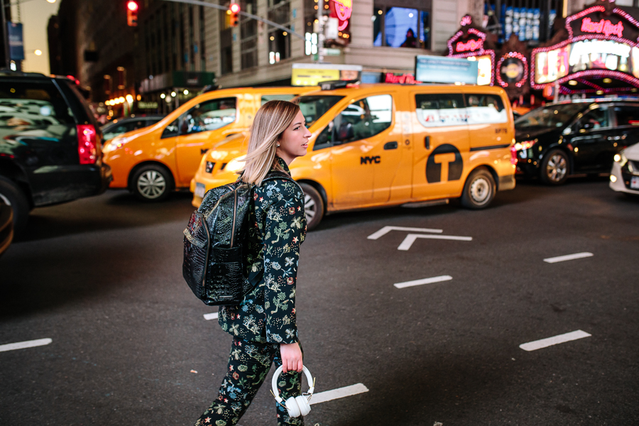 NYC Blogger, Times Square NYC, night time in Times Square, Yellow Taxi Cabs, H&M Coordinating set, Sudio headphones, Brahmin black leather backpack, commuting in NYC, lights in times square, night time in NYC
