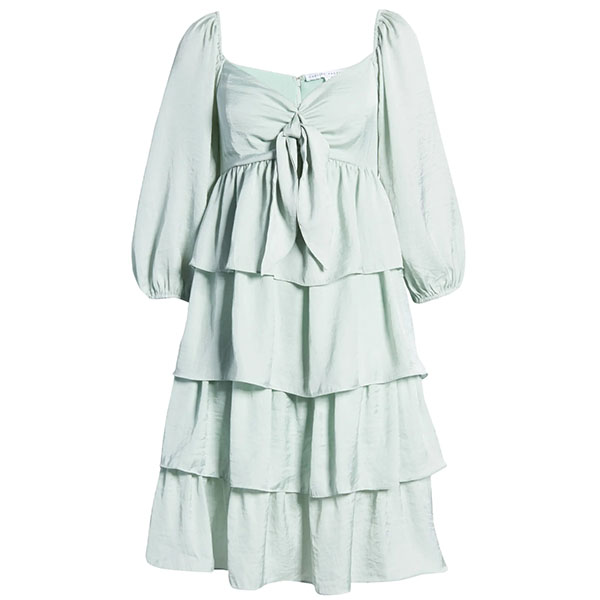 A bow embellishment accentuates the sweetheart neckline of a swingy, tiered minidress that channels vintage romance.